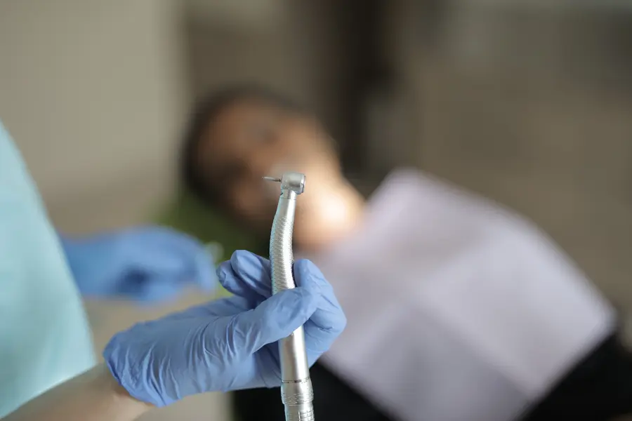 nitrous-oxide-sedation-montgomery-county-dentist-holding-dental-drill-handpiece